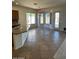 Kitchen with an island, granite countertops, and tiled floor at 20457 N 80Th Dr, Peoria, AZ 85382