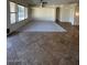 Spacious living room with tile and carpet flooring at 20457 N 80Th Dr, Peoria, AZ 85382