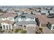 Two-story house with solar panels, two-car garage, and landscaped yard at 21002 E Mayberry Rd, Queen Creek, AZ 85142