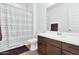 Double vanity bathroom with a patterned shower curtain at 21002 E Mayberry Rd, Queen Creek, AZ 85142