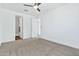 Light and airy bedroom with carpet and ensuite bathroom access at 21002 E Mayberry Rd, Queen Creek, AZ 85142