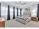 Main bedroom with plush bed and plenty of natural light at 21002 E Mayberry Rd, Queen Creek, AZ 85142