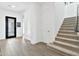 Bright entryway with tile floors and staircase at 21002 E Mayberry Rd, Queen Creek, AZ 85142