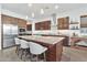 Modern kitchen with island, stainless steel appliances, and white cabinets at 21002 E Mayberry Rd, Queen Creek, AZ 85142