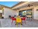 Covered patio with dining table and comfortable seating at 21002 E Mayberry Rd, Queen Creek, AZ 85142