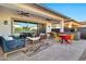 Covered patio with seating area, grill and outdoor fans at 21002 E Mayberry Rd, Queen Creek, AZ 85142