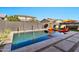 Inviting swimming pool with a spa and lounge chairs at 21002 E Mayberry Rd, Queen Creek, AZ 85142