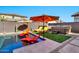 Relaxing pool area with colorful umbrellas and lounge chairs at 21002 E Mayberry Rd, Queen Creek, AZ 85142