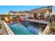 Luxury pool and patio with outdoor kitchen and seating at 21002 E Mayberry Rd, Queen Creek, AZ 85142