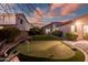 Landscaped backyard with putting green, great for recreation at 2207 W Hidden Treasure Way, Phoenix, AZ 85086