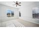 Bright bedroom with ceiling fan and window shutters at 2207 W Hidden Treasure Way, Phoenix, AZ 85086