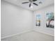 Bright bedroom with ceiling fan and window shutters at 2207 W Hidden Treasure Way, Phoenix, AZ 85086