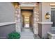 Elegant entryway with stone accents and double doors at 2207 W Hidden Treasure Way, Phoenix, AZ 85086