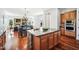 Kitchen island with granite countertop and stone base at 2207 W Hidden Treasure Way, Phoenix, AZ 85086