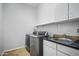 Laundry room with modern washer and dryer at 2207 W Hidden Treasure Way, Phoenix, AZ 85086