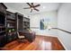 Home office with built-in shelving and a large desk at 2207 W Hidden Treasure Way, Phoenix, AZ 85086