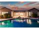 Stunning pool and patio area with beautiful sunset reflection at 2207 W Hidden Treasure Way, Phoenix, AZ 85086