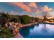 Relaxing pool and spa area with a tranquil waterfall feature at 2207 W Hidden Treasure Way, Phoenix, AZ 85086