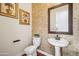 Powder room with pedestal sink and decorative walls at 2207 W Hidden Treasure Way, Phoenix, AZ 85086