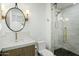 Clean bathroom with a modern vanity, hexagon tile flooring and a glass shower at 2246 E Bethany Home Rd, Phoenix, AZ 85016