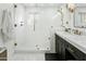 Clean bathroom with walk-in shower, marble vanity, and subway tile at 2246 E Bethany Home Rd, Phoenix, AZ 85016