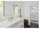 Contemporary bathroom with marble vanity and a walk-in shower at 2246 E Bethany Home Rd, Phoenix, AZ 85016