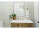 Charming bathroom with patterned tile and a wood vanity at 2246 E Bethany Home Rd, Phoenix, AZ 85016