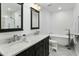 Elegant bathroom with double vanity, soaking tub, and walk-in shower at 2246 E Bethany Home Rd, Phoenix, AZ 85016