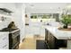 Modern kitchen with marble countertops, range, and island at 2246 E Bethany Home Rd, Phoenix, AZ 85016