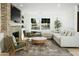 Light and airy living room with a comfortable sectional sofa at 2246 E Bethany Home Rd, Phoenix, AZ 85016