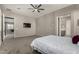 Large bedroom with en-suite bathroom and TV at 22643 E Stonecrest Dr, Queen Creek, AZ 85142