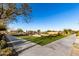 Well-manicured grassy area with concrete sidewalks in a community setting at 22643 E Stonecrest Dr, Queen Creek, AZ 85142