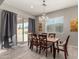 Dining area with wooden table, chandelier, and access to backyard at 22643 E Stonecrest Dr, Queen Creek, AZ 85142