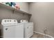 Bright laundry room with washer and dryer at 22643 E Stonecrest Dr, Queen Creek, AZ 85142