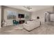 Living room featuring a teal accent chair and gray sofa at 22643 E Stonecrest Dr, Queen Creek, AZ 85142