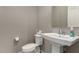 Clean powder room with pedestal sink and toilet at 22643 E Stonecrest Dr, Queen Creek, AZ 85142