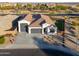 Single story home with a two-car garage and landscaped yard at 2408 N Morrison Ave, Casa Grande, AZ 85122