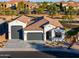 Single story home with a two-car garage and landscaped yard at 2408 N Morrison Ave, Casa Grande, AZ 85122