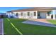 Spacious backyard with artificial turf and a paved patio area at 2408 N Morrison Ave, Casa Grande, AZ 85122