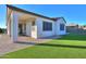 Backyard patio with artificial turf and a covered patio at 2408 N Morrison Ave, Casa Grande, AZ 85122