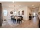 Open dining room with view into kitchen and entryway at 2408 N Morrison Ave, Casa Grande, AZ 85122