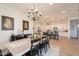 Open concept dining room and kitchen with white cabinets at 2408 N Morrison Ave, Casa Grande, AZ 85122