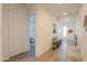 Bright entryway with wood-look floors and bench at 2408 N Morrison Ave, Casa Grande, AZ 85122