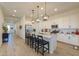 Spacious kitchen with granite island, stainless steel appliances, and white cabinets at 2408 N Morrison Ave, Casa Grande, AZ 85122