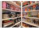 Well-organized pantry with ample shelving for storage at 2408 N Morrison Ave, Casa Grande, AZ 85122