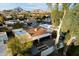 Aerial view of a home with a tile roof, landscaped backyard, and tall trees at 2423 E Marshall Ave, Phoenix, AZ 85016