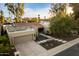 Aerial view of a single-story home with a tile roof, landscaped yard, and a two-car garage at 2423 E Marshall Ave, Phoenix, AZ 85016