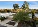 Aerial view of a single-story home with a tile roof, landscaped yard, and a two-car garage at 2423 E Marshall Ave, Phoenix, AZ 85016