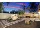 Relaxing backyard oasis with stone pathways and water feature at 2423 E Marshall Ave, Phoenix, AZ 85016