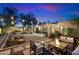 Spacious backyard with fire pit, patio furniture and string lights at 2423 E Marshall Ave, Phoenix, AZ 85016